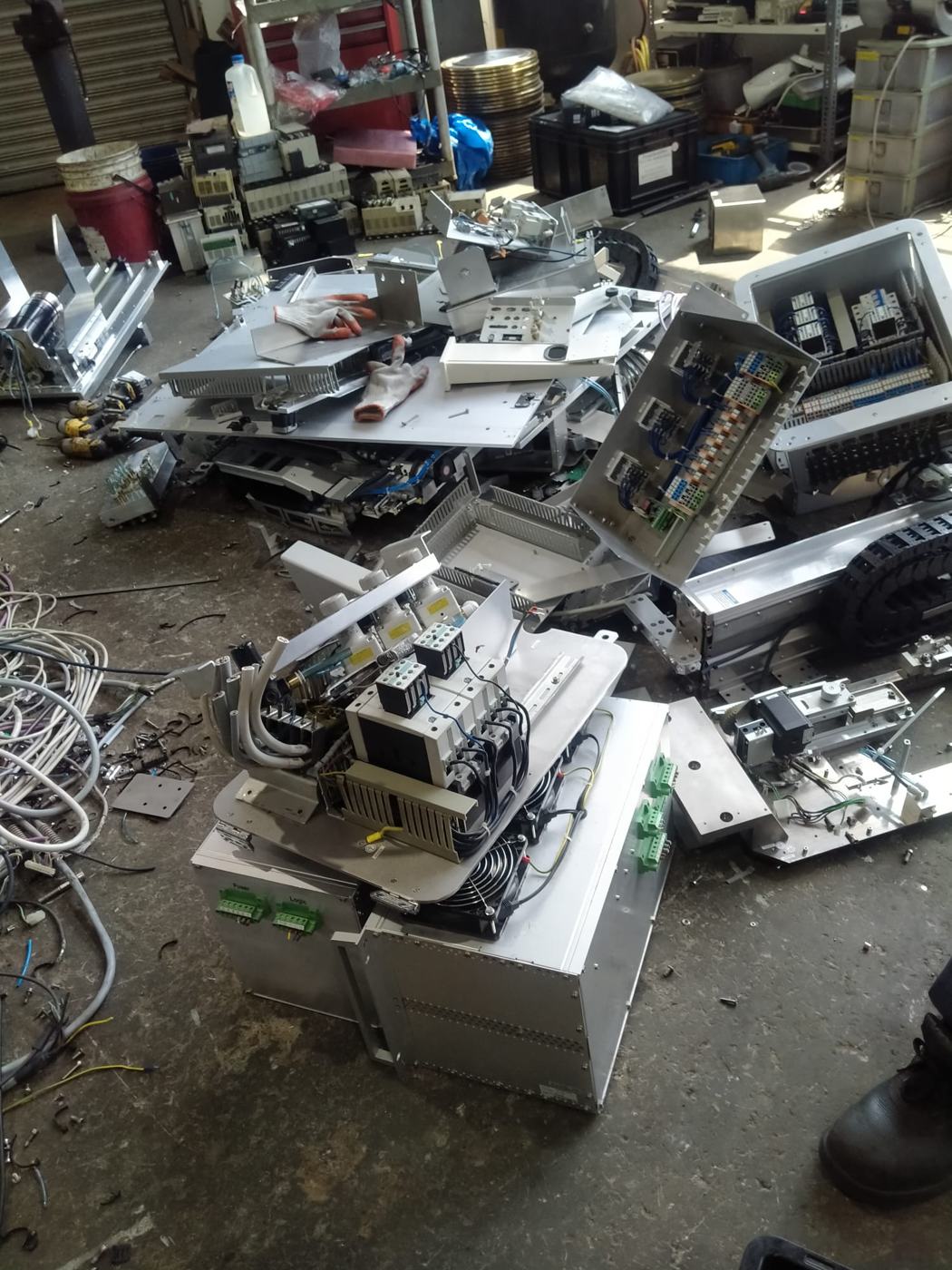 Dismantled machine parts piled for sorting