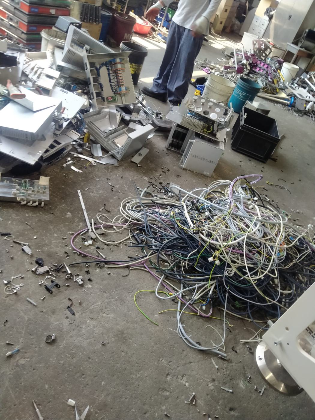 Wiring being pulled from dismantled machines