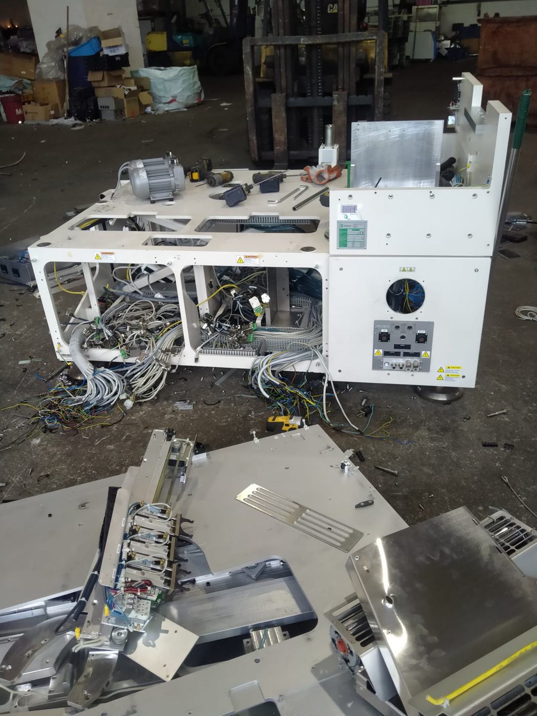 A machine with its covers removed and components exposed