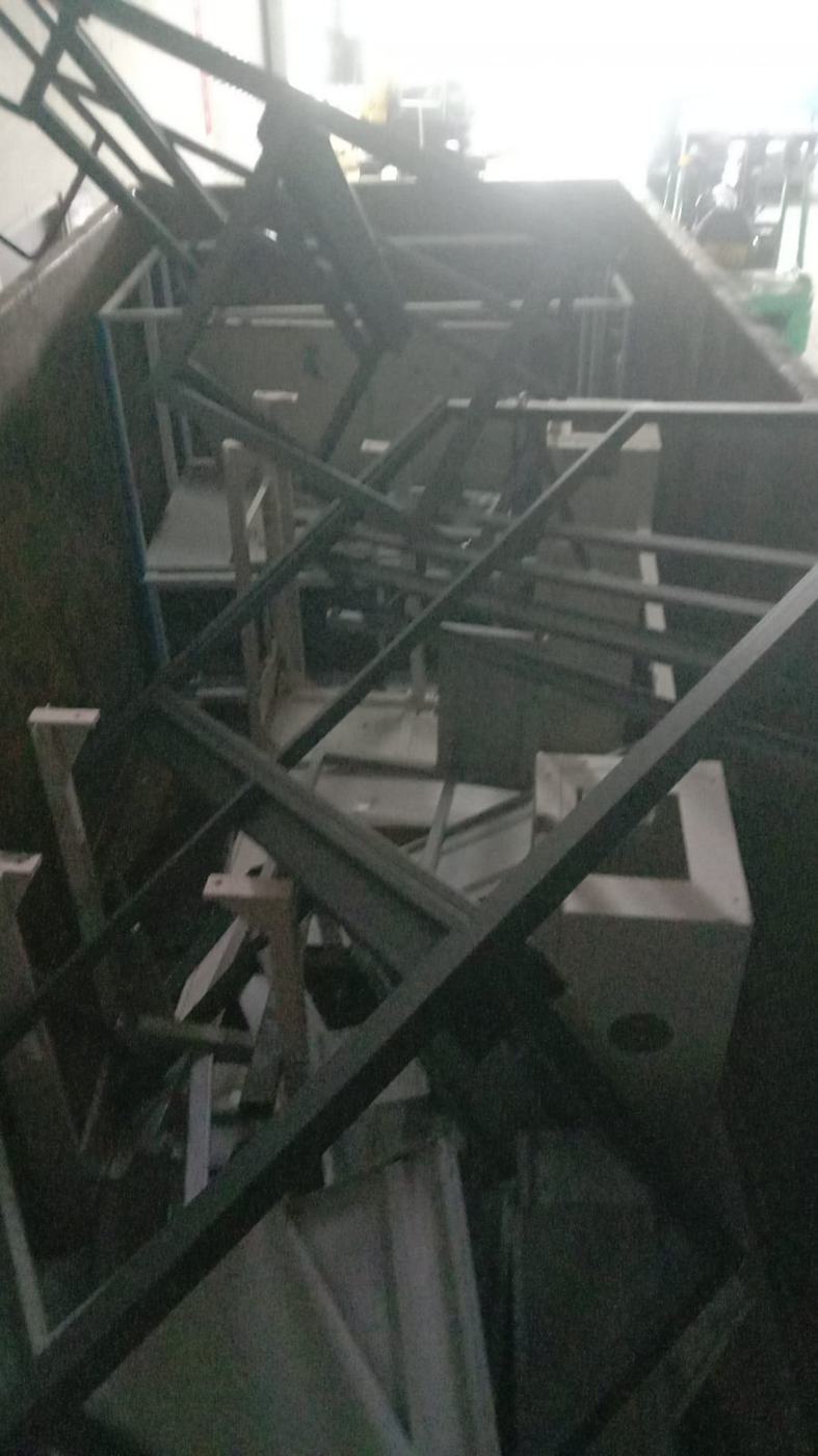 Metal frames stacked in a skid bin